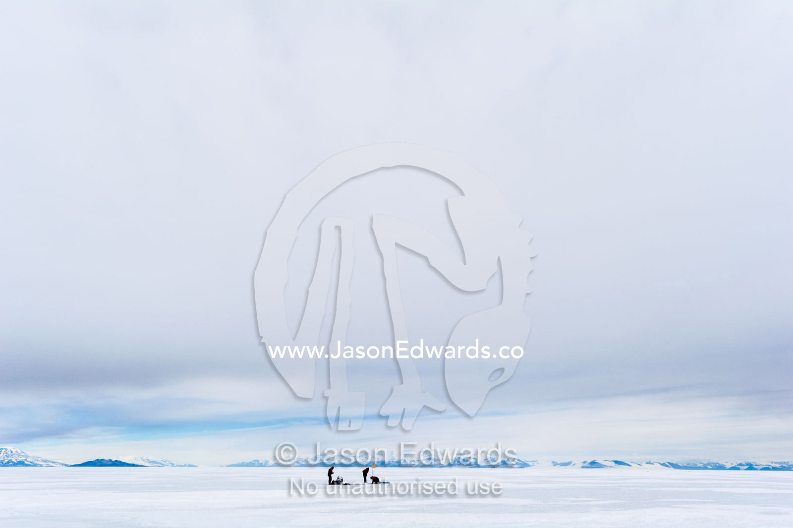 On the vast sea ice researchers drill core samples to collect extremophiles from beneath the ice to study. Turtle Rock, Erebus Bay, McMurdo Sound, Ross Island, Antarctica.