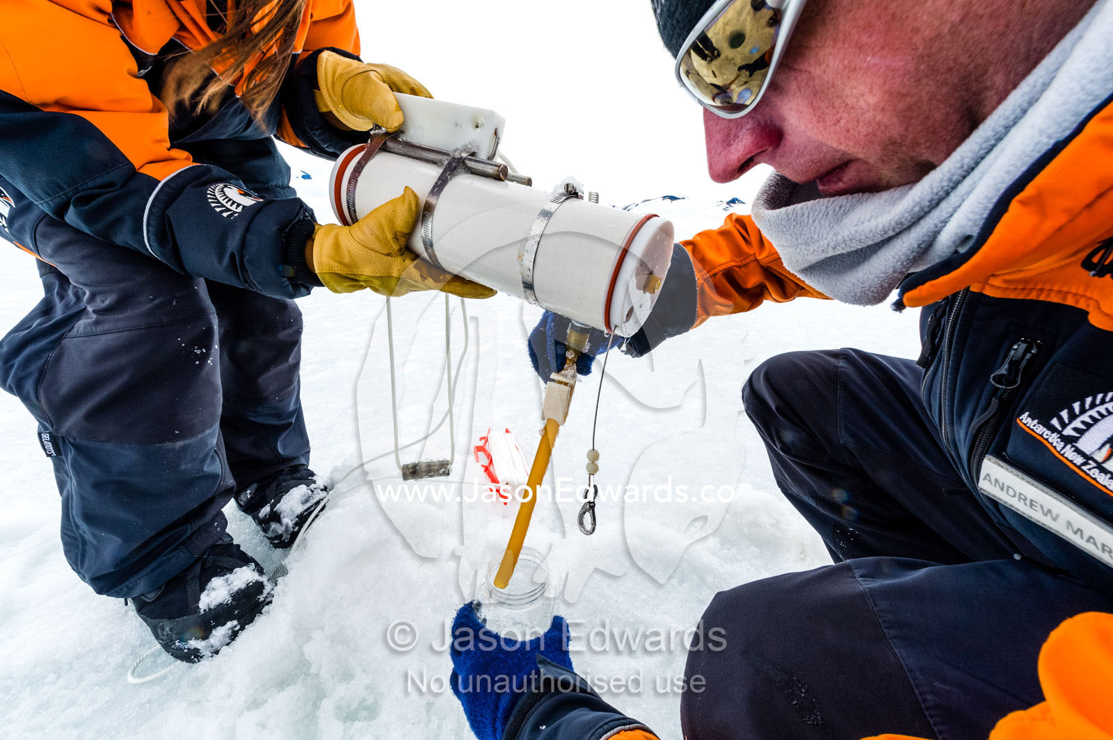 Researchers drill core samples from the sea ice to collect extremophiles from the ocean beneath the ice to study. Turtle Rock, Erebus Bay, McMurdo Sound, Ross Island, Antarctica.