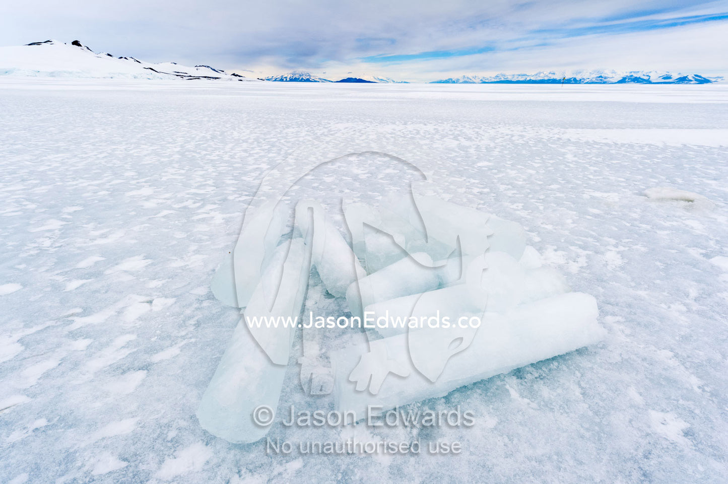 Researchers drill core samples from the sea ice to collect extremophiles to study. Turtle Rock, Erebus Bay, McMurdo Sound, Ross Island, Antarctica.