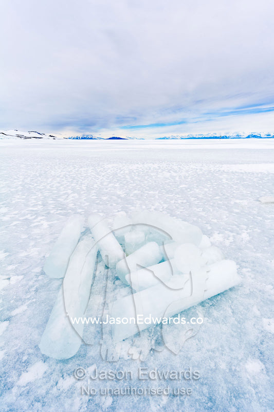 Researchers drill core samples from the sea ice to collect extremophiles to study. Turtle Rock, Erebus Bay, McMurdo Sound, Ross Island, Antarctica.