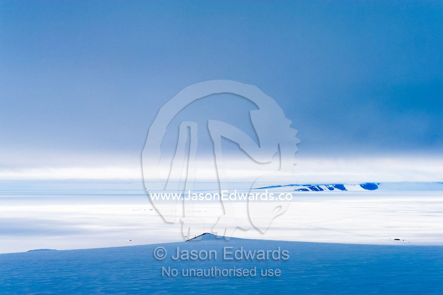 A storm descends over the Ross Ice Shelf casting deep shadows on the ice. Ross Ice Shelf, McMurdo Sound, Ross Island, Antarctica.