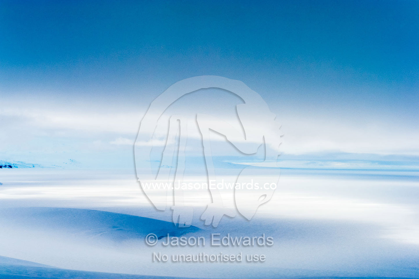 A storm descends over the Ross Ice Shelf casting deep shadows on the ice. Ross Ice Shelf, McMurdo Sound, Ross Island, Antarctica.