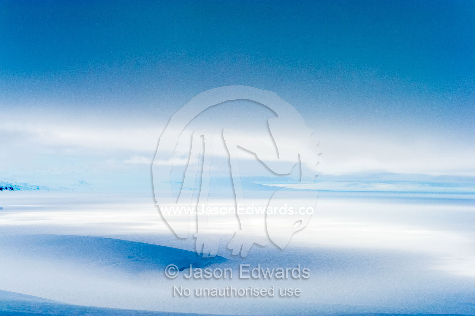 A storm descends over the Ross Ice Shelf casting deep shadows on the ice. Ross Ice Shelf, McMurdo Sound, Ross Island, Antarctica.
