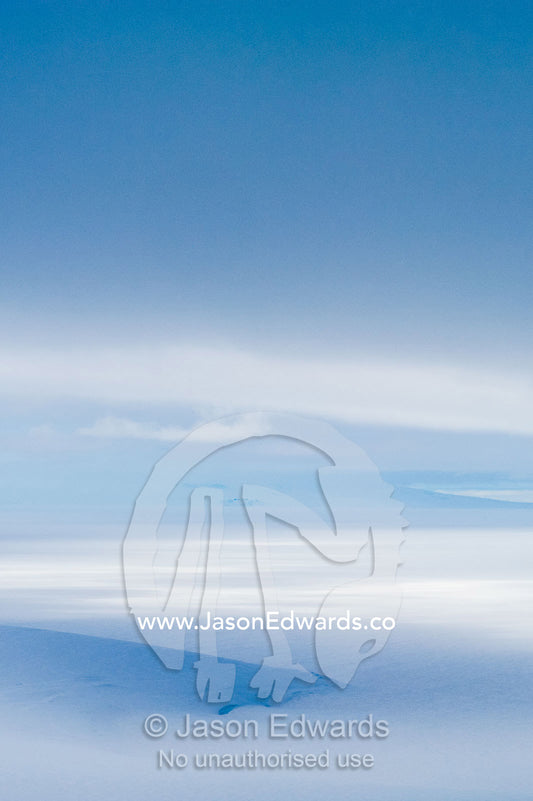 A storm descends over the Ross Ice Shelf casting deep shadows on the ice. Ross Ice Shelf, McMurdo Sound, Ross Island, Antarctica.