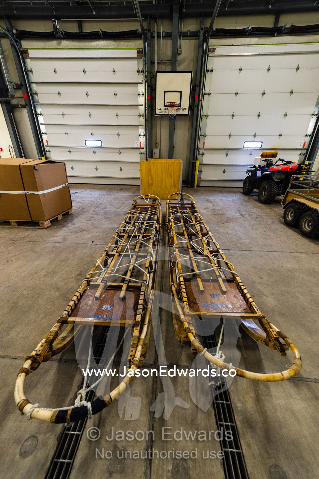 Antique timber sleds in a vehicle dock on an Antarctic base. Scott Base, Pram Point, Hut Point Peninsula, Ross Island, Antarctica.