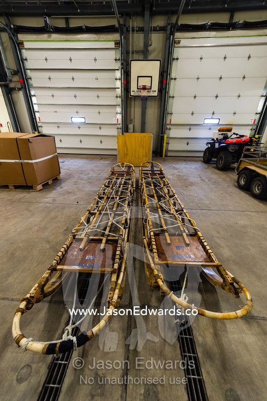 Antique timber sleds in a vehicle dock on an Antarctic base. Scott Base, Pram Point, Hut Point Peninsula, Ross Island, Antarctica.