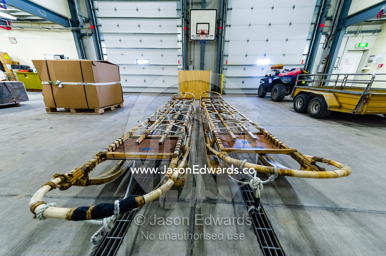Antique timber sleds in a vehicle dock on an Antarctic base. Scott Base, Pram Point, Hut Point Peninsula, Ross Island, Antarctica.