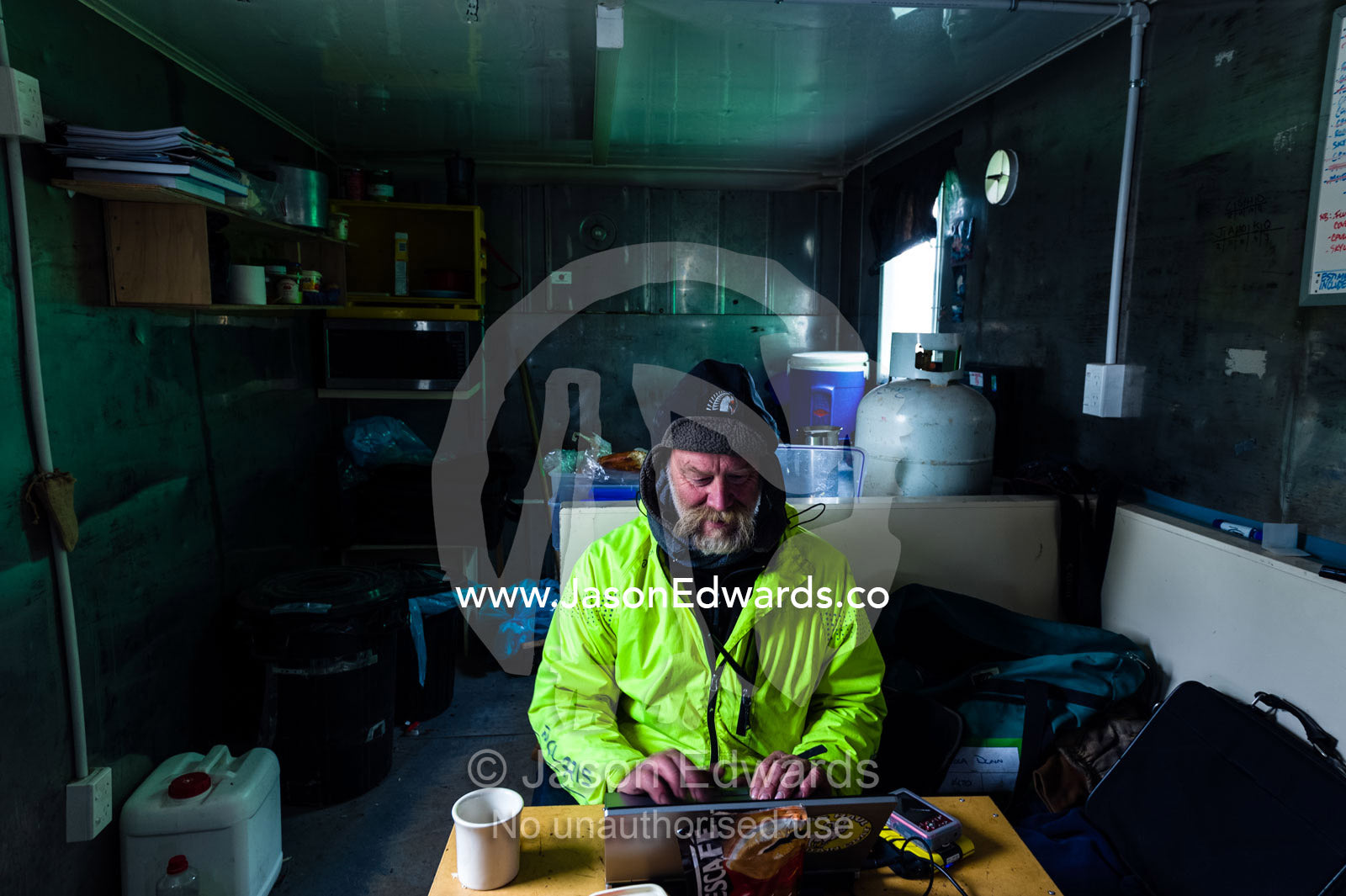 An expert from the Antarctic Heritage Trust working on Discovery Hut on Ross Island. Discovery Hut, Hut Point, Ross Island, Antarctica.