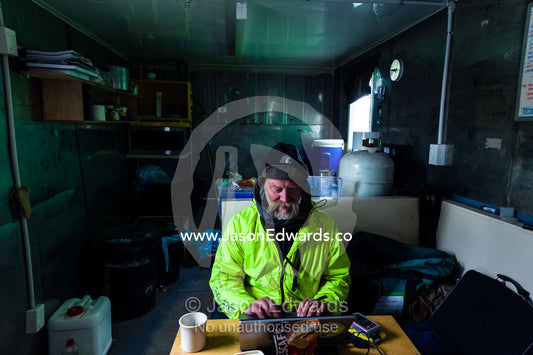 An expert from the Antarctic Heritage Trust working on Discovery Hut on Ross Island. Discovery Hut, Hut Point, Ross Island, Antarctica.