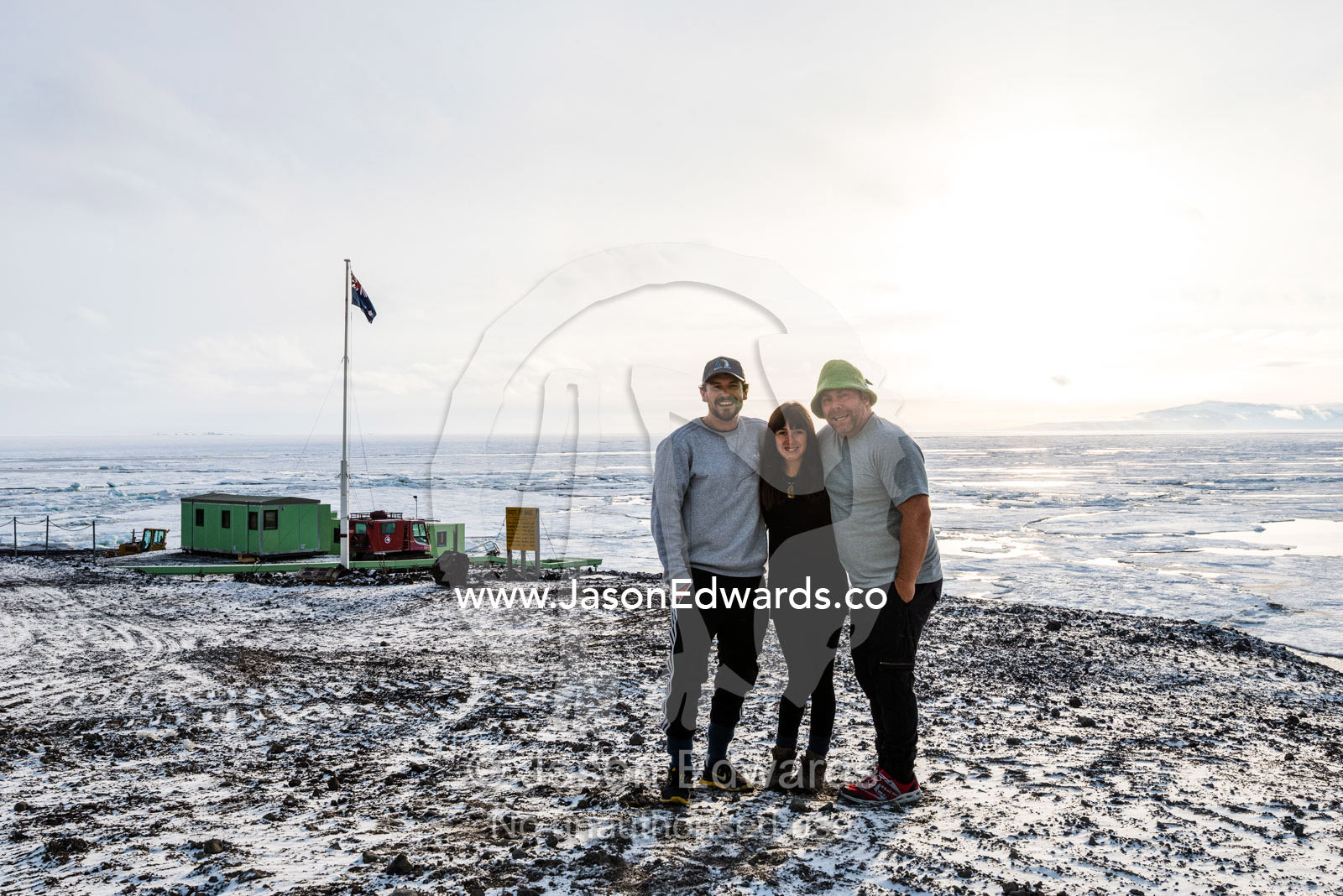 Friends gather beneath the midnight sun in Antarctica. Scott Base, Pram Point, Hut Point Peninsula, Ross Island, Antarctica.