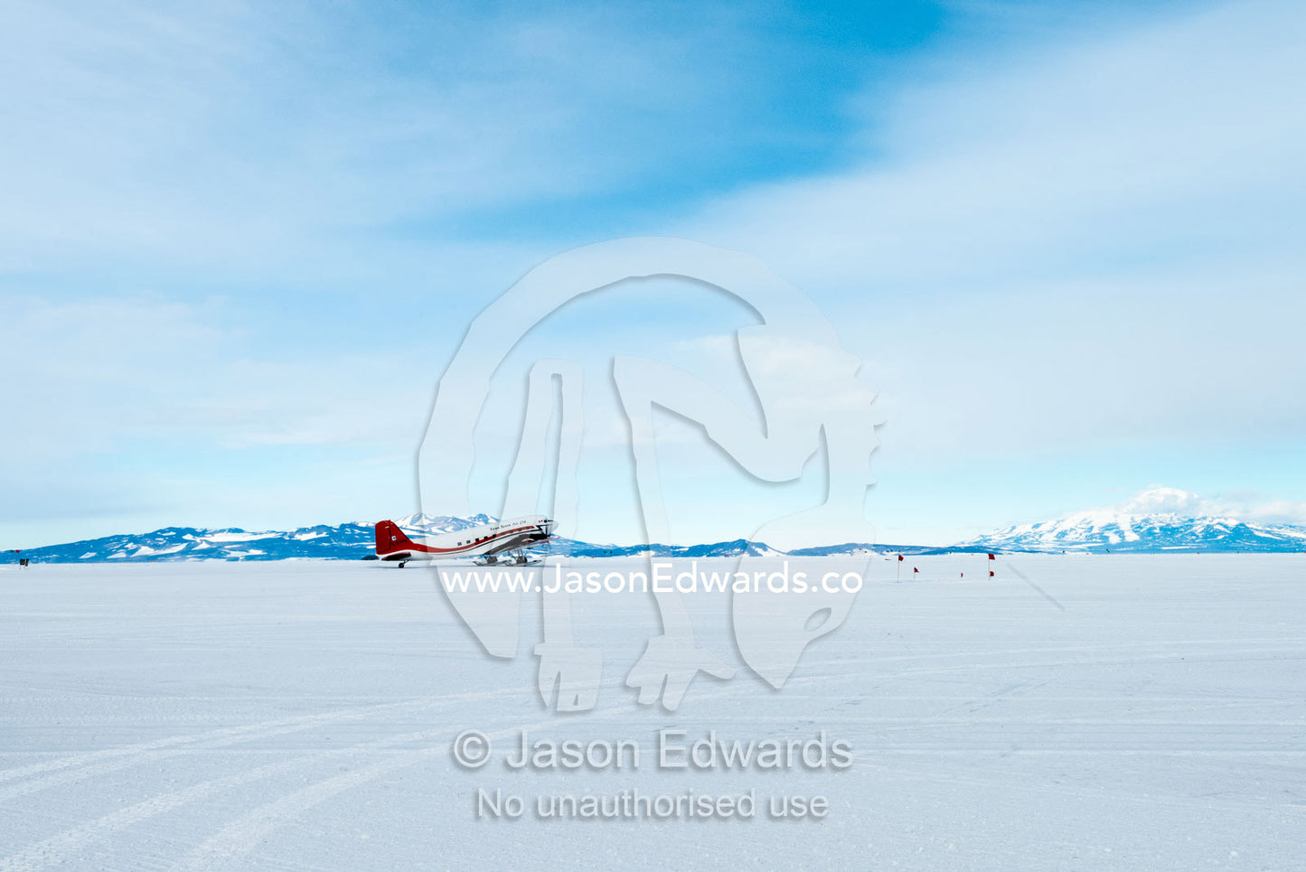 A Basler BT-67, Kenn Borek Air, on the ice tarmac in Antarctica. Royal Society Range, Pegasus Field, McMurdo Ice Shelf, Ross Island, McMurdo Sound, Antarctica.