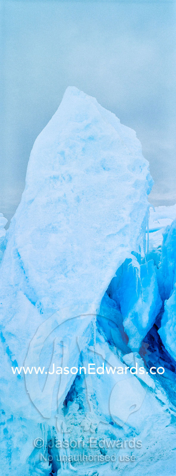 Fractured ice blocks pushed skywards along pressure ridges in the sea ice. Turtle Rock, Erebus Bay, McMurdo Sound, Ross Island, Antarctica.