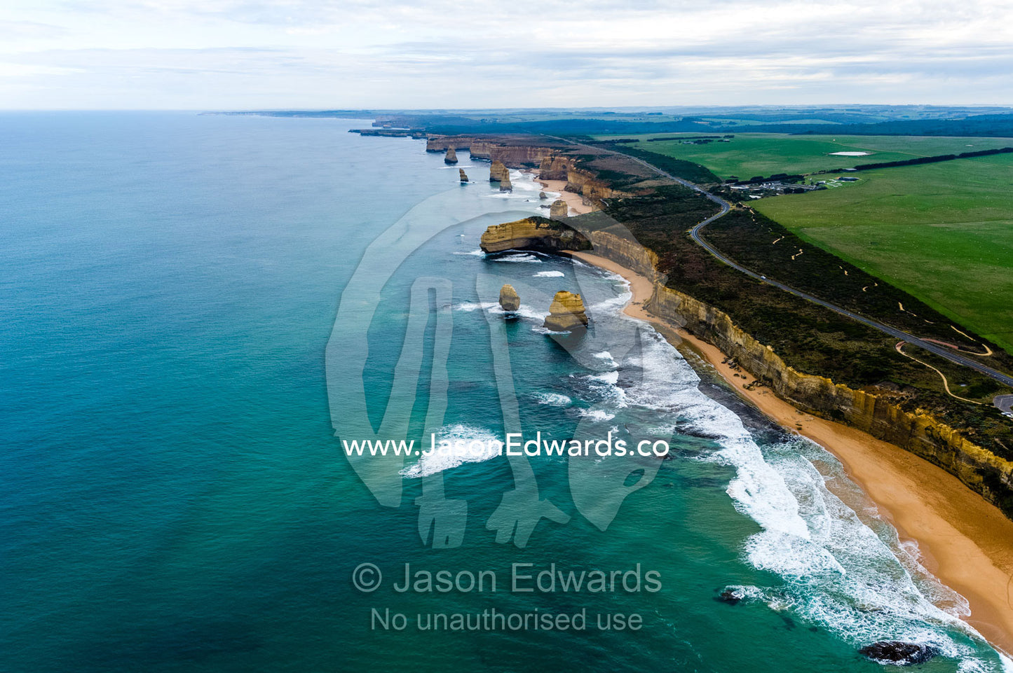 An aerial view of the sheer limestone cliffs and the Twelve Apostles pillars. Twelve Apostles, Port Campbell National, Great Ocean Road, Victoria, Australia.