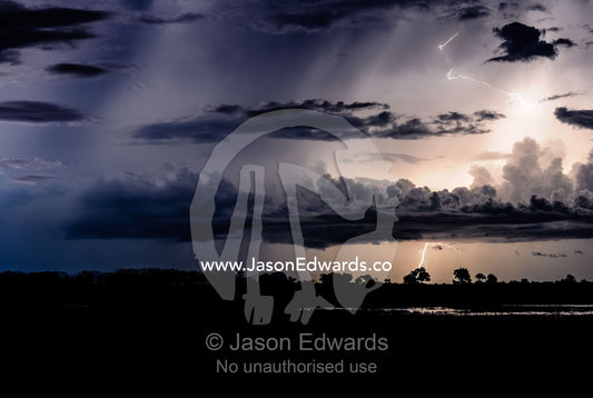A violent electrical storm flashes lightning above a floodplain. Chobe River, Chobe National Park, Botswana.