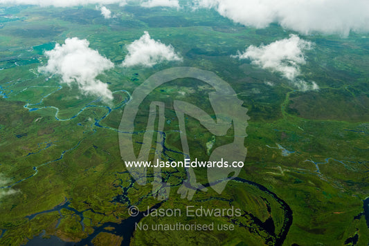 An aerial view of winding rivers flowing across a lush floodplain. Chobe National Park, Botswana.