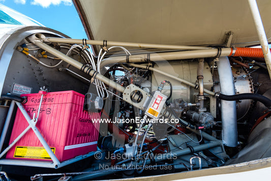 The cowling of a light plane to allow the engine to cool down after flight. Duba Plains Camp, Ngamiland West, Botswana.
