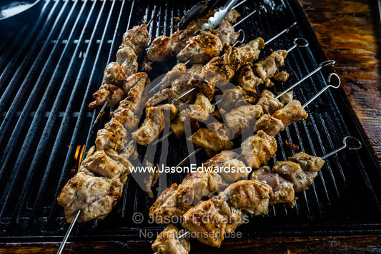 Chicken skewers on a barbecue grill in a African safari camp. Zarafa Camp, Zibadianja Lagoon, Savute Channel, Linyanti, Botswana.