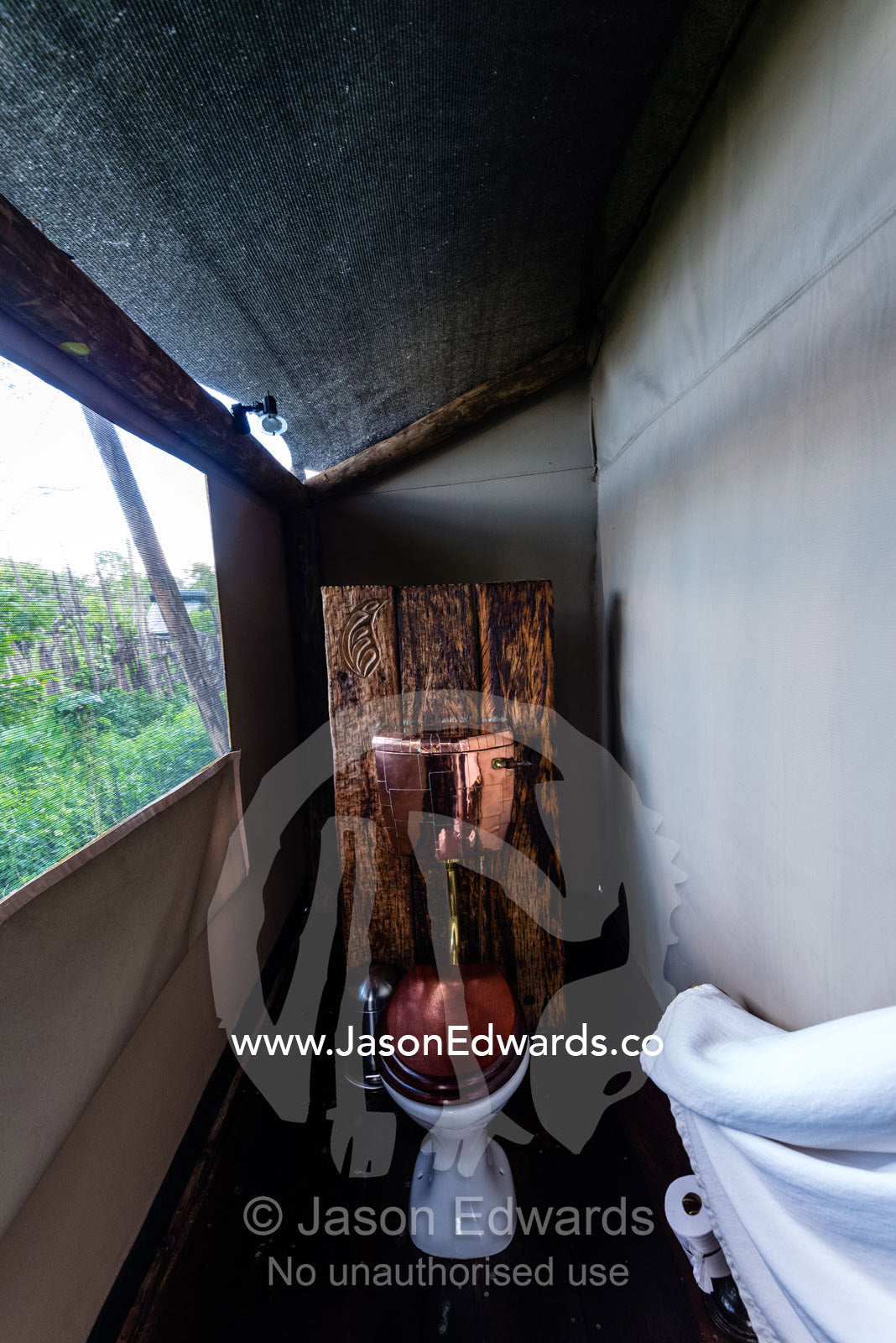 A flushing toilet in a luxurious safari camp tent. Zarafa Camp, Zibadianja Lagoon, Savute Channel, Linyanti, Botswana.