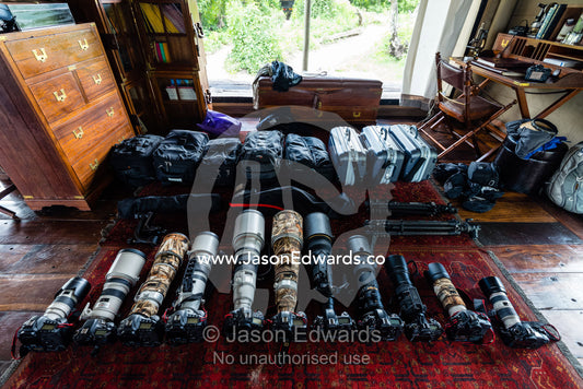 A collection of long lenses and cameras for photographers on safari. Zarafa Camp, Zibadianja Lagoon, Savute Channel, Linyanti, Botswana.