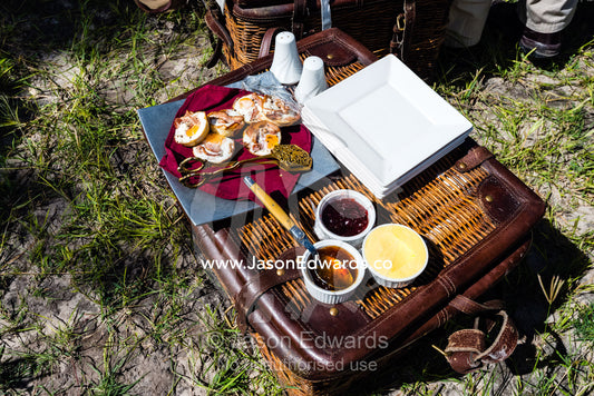 Bacon and eggs served with jam on a wicker basket for breakfast on safari. Zarafa Camp, Zibadianja Lagoon, Savute Channel, Linyanti, Botswana.