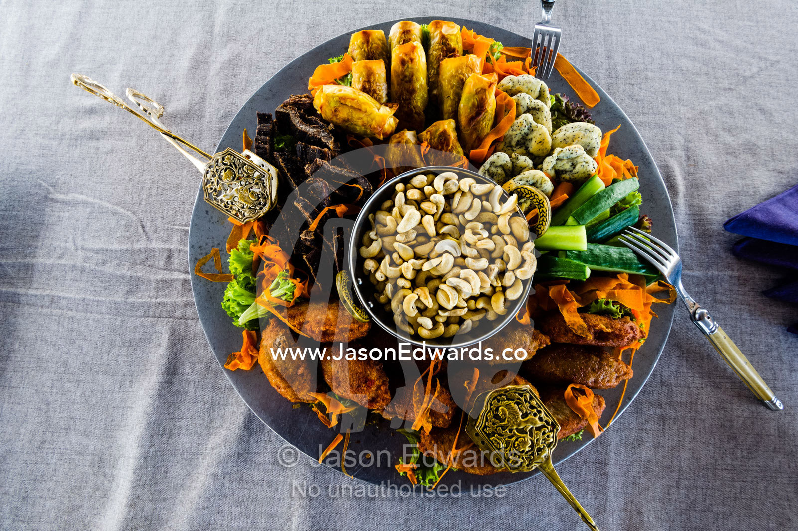 Nuts and canape's served on a river barge on a luxury safari. Zarafa Camp, Zibadianja Lagoon, Savute Channel, Linyanti, Botswana.