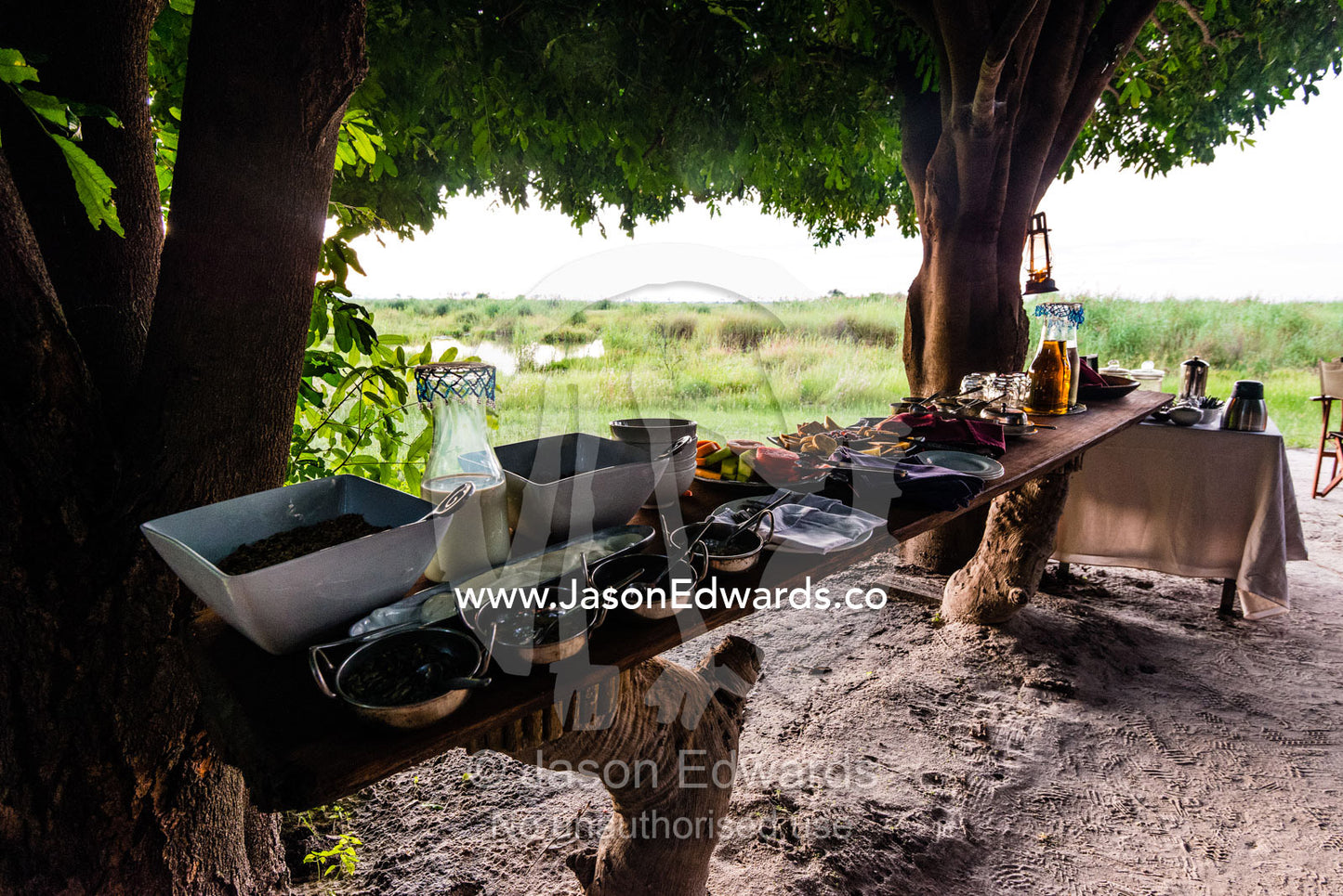 A breakfast buffet of cereal and fruit at a luxury safari camp. Selinda Camp, Selinda Reserve, Linyanti Region, Northern Botswana.