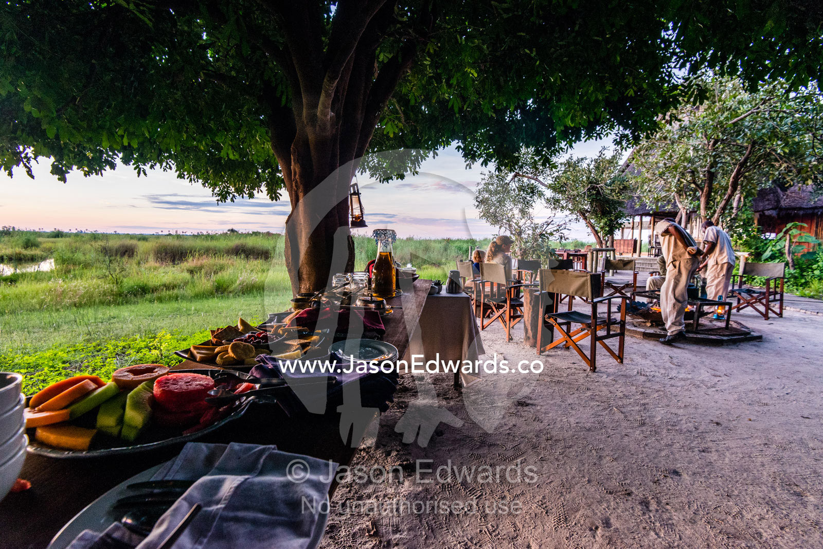 A breakfast buffet of cereal and fruit at a luxury safari camp. Selinda Camp, Selinda Reserve, Linyanti Region, Northern Botswana.