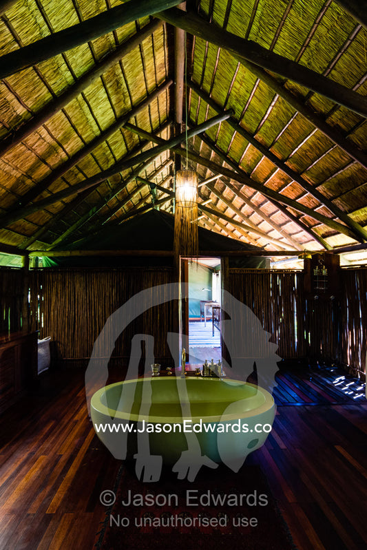 A bath tub in a luxurious safari camp tent. Selinda Camp, Selinda Reserve, Linyanti Region, Northern Botswana.