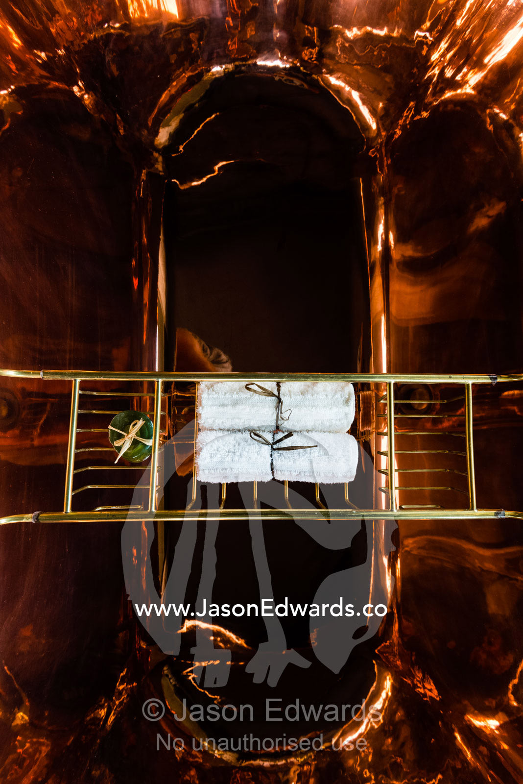 A polished copper bath in a luxurious safari camp tent. Zarafa Camp, Zibadianja Lagoon, Savute Channel, Linyanti, Botswana.