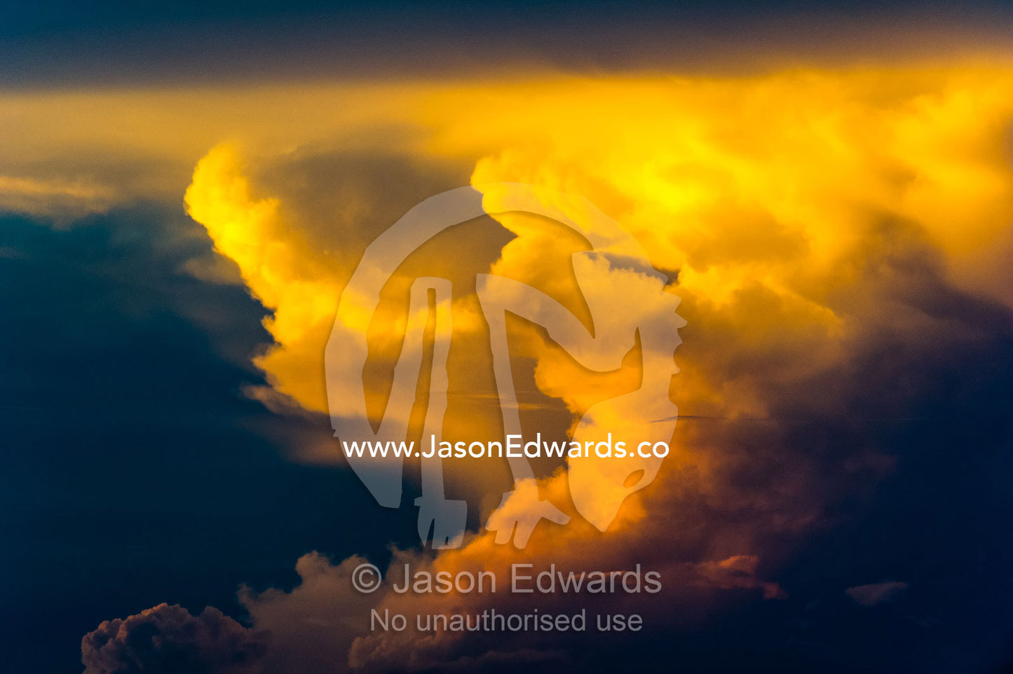 A fiery mass of clouds emerge from a thunderhead at sunset. Selinda Spillway, Selinda Reserve, Linyanti Region, Northern Botswana.