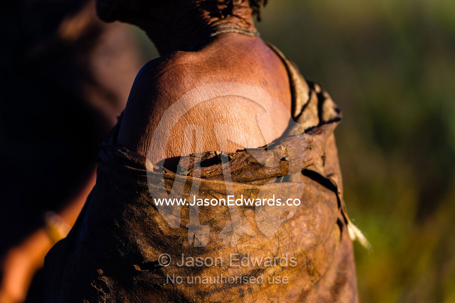 The exposed shoulder skin of a San Bushmen dressed in leather animal skins. Kalahari Desert, Botswana.