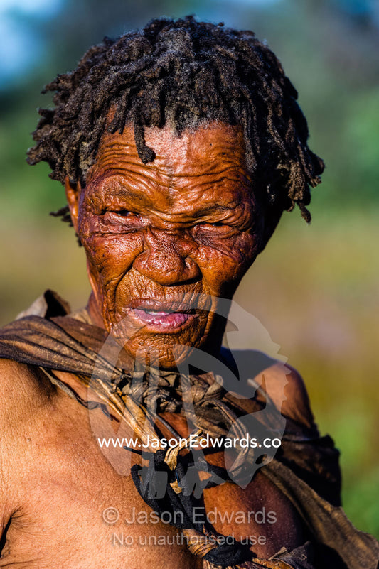 The leathery wrinkled skin on the face of a San Bushmen elder. Kalahari Desert, Botswana.