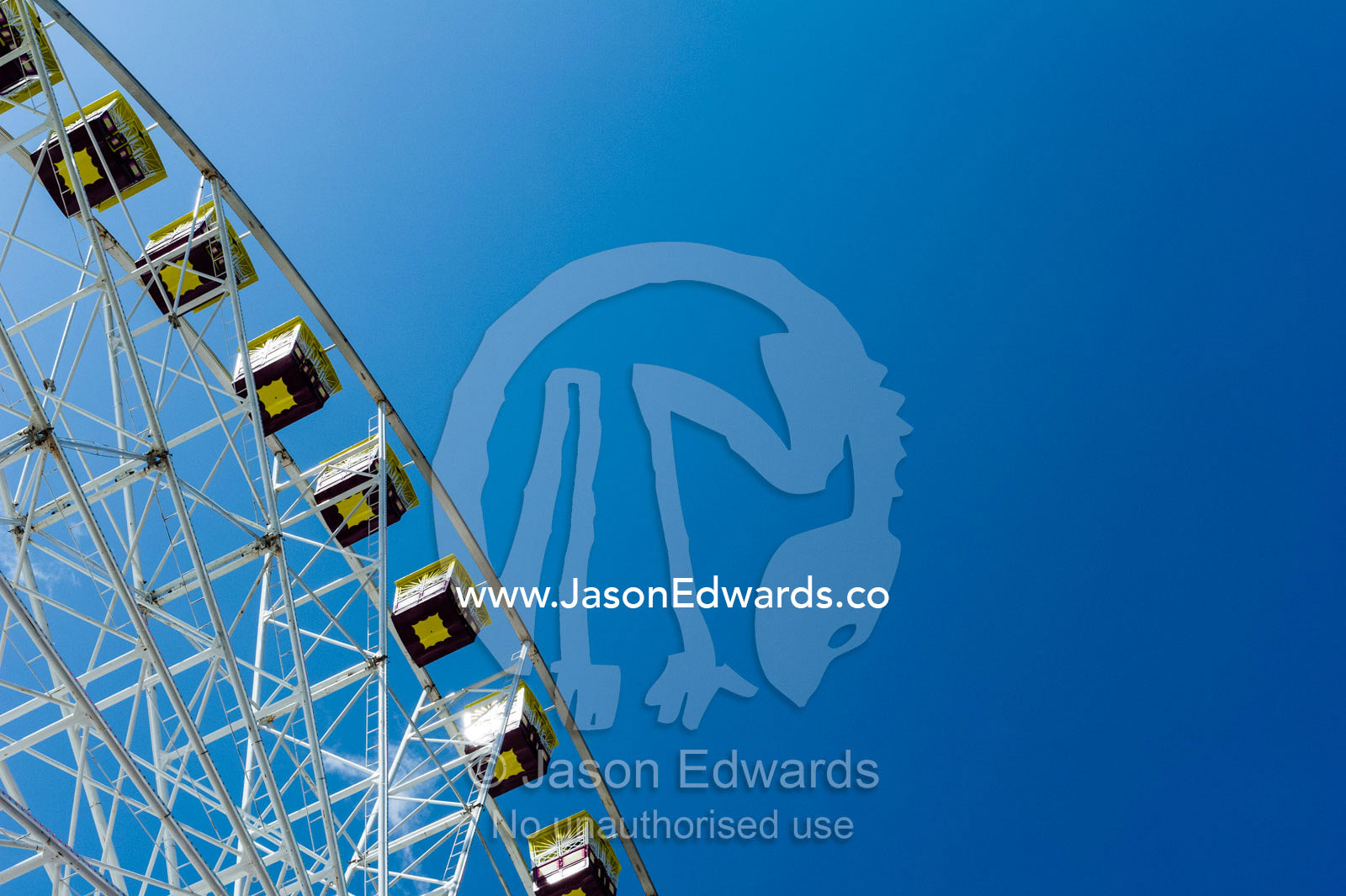 The carriages of a Ferris wheel against a blue sky at an agricultural show. Royal Melbourne Show, Flemington, Melbourne, Victoria, Australia.