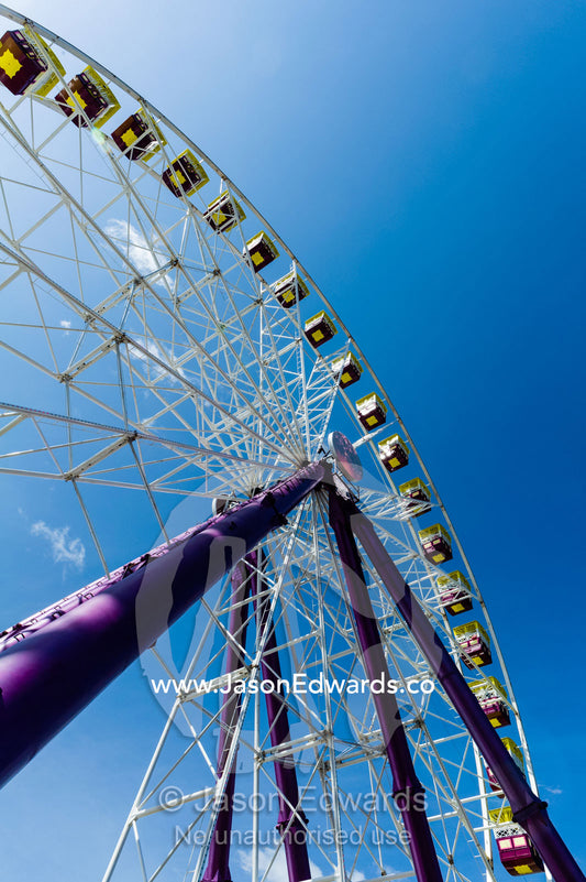 The carriages of a Ferris wheel against a blue sky at an agricultural show. Royal Melbourne Show, Flemington, Melbourne, Victoria, Australia.