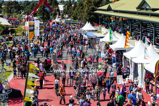 Crowds of visitors enjoy the sunshine at an agricultural show. Royal Melbourne Show, Flemington, Melbourne, Victoria, Australia.