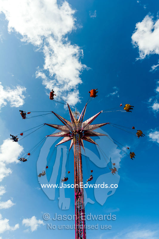 A scary sideshow attraction high in the sky at an agricultural show. Royal Melbourne Show, Flemington, Melbourne, Victoria, Australia.