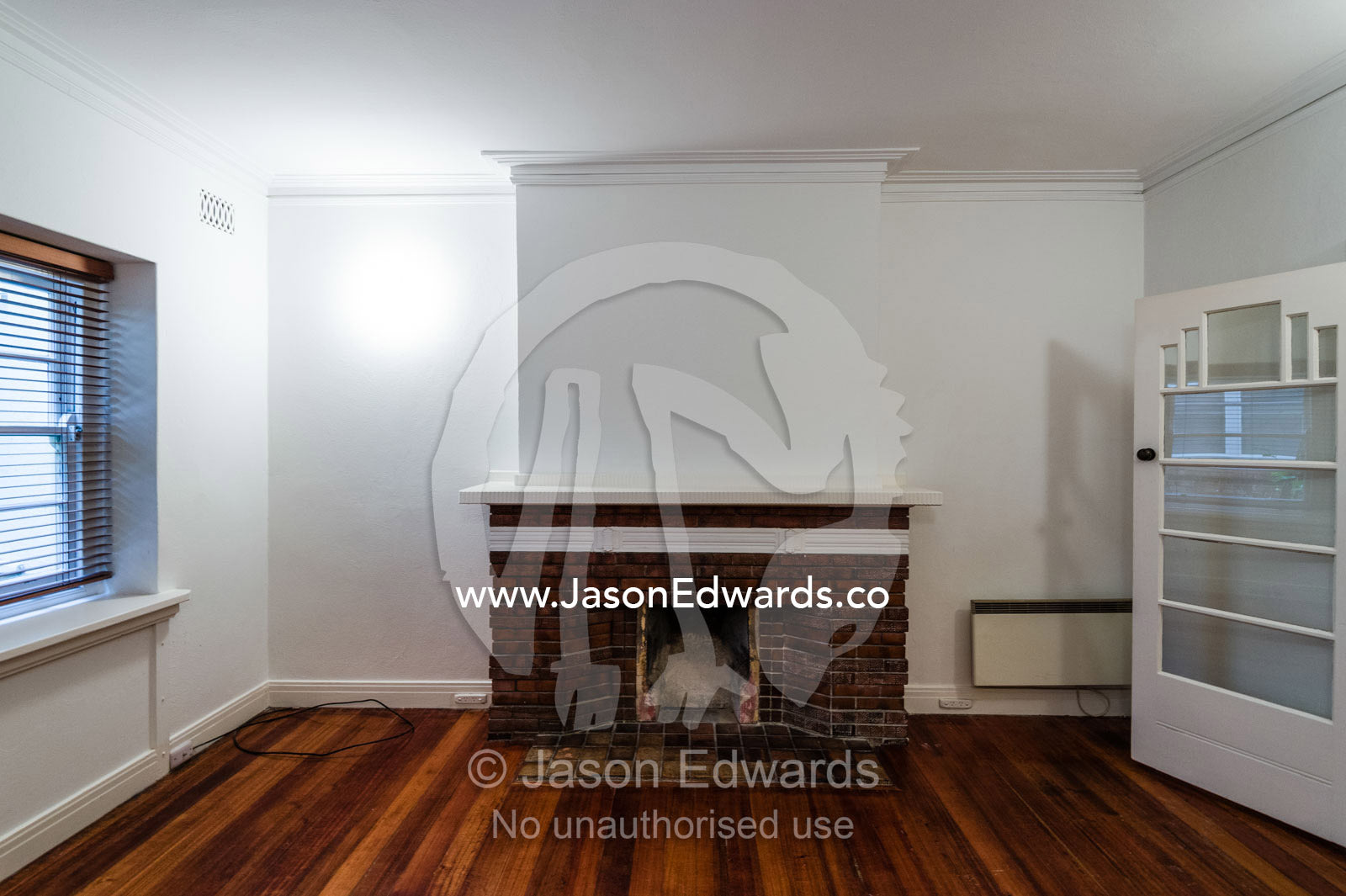 A fire place in the living room of an inner city rental apartment. St Kilda, Melbourne, Victoria, Australia.