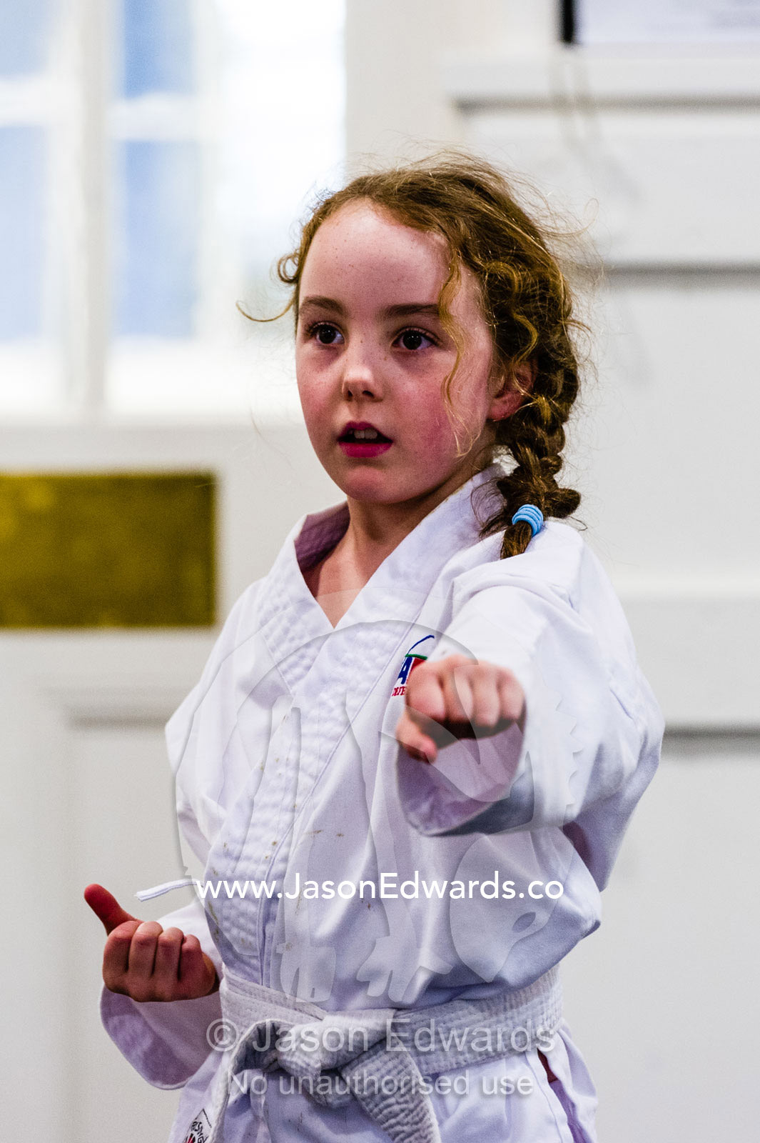 A girl throwing a punch during karate training. Carlton North, Melbourne, Victoria, Australia.