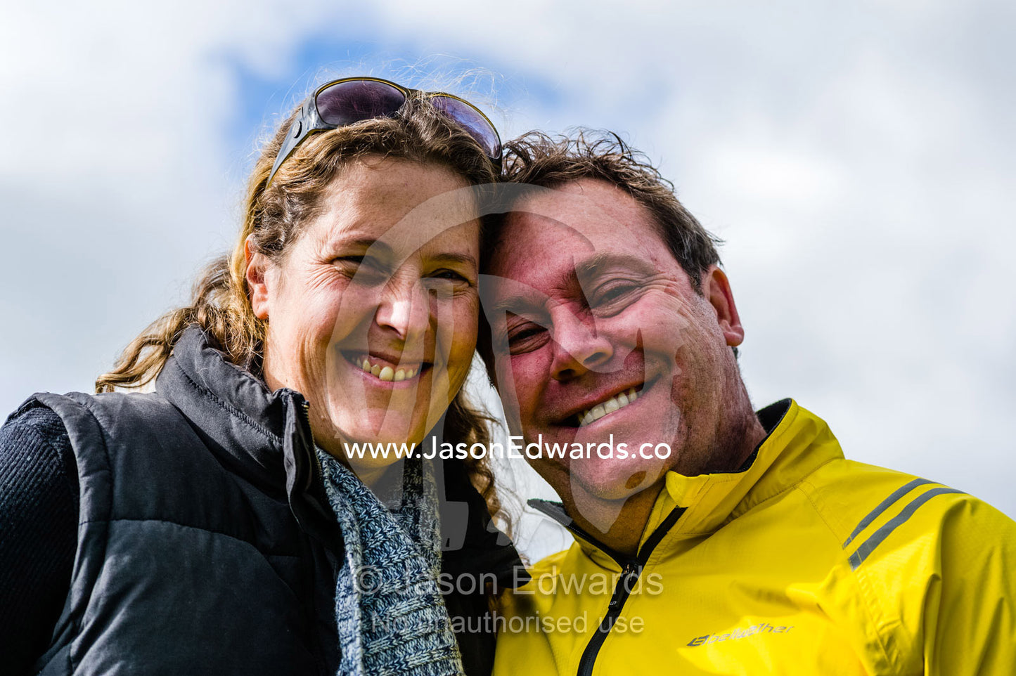 A smiling couple waiting for the husband to do his first parachute jump. Torquay, Surf Coast, Victoria, Australia.
