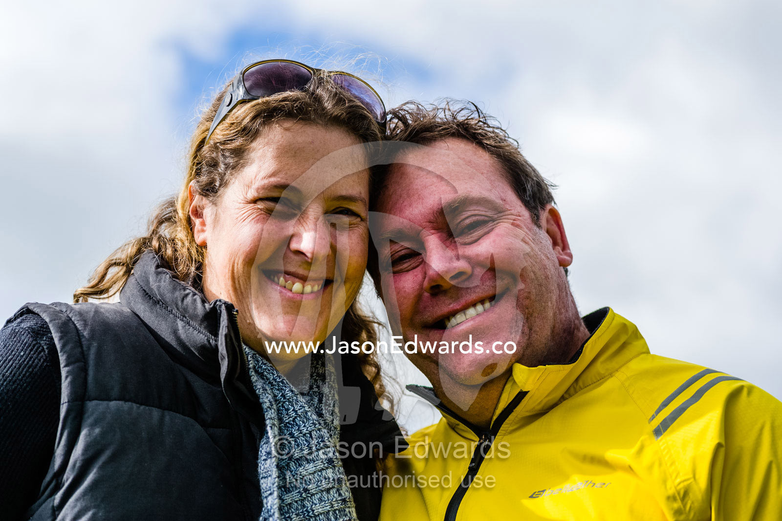 A smiling couple waiting for the husband to do his first parachute jump. Torquay, Surf Coast, Victoria, Australia.