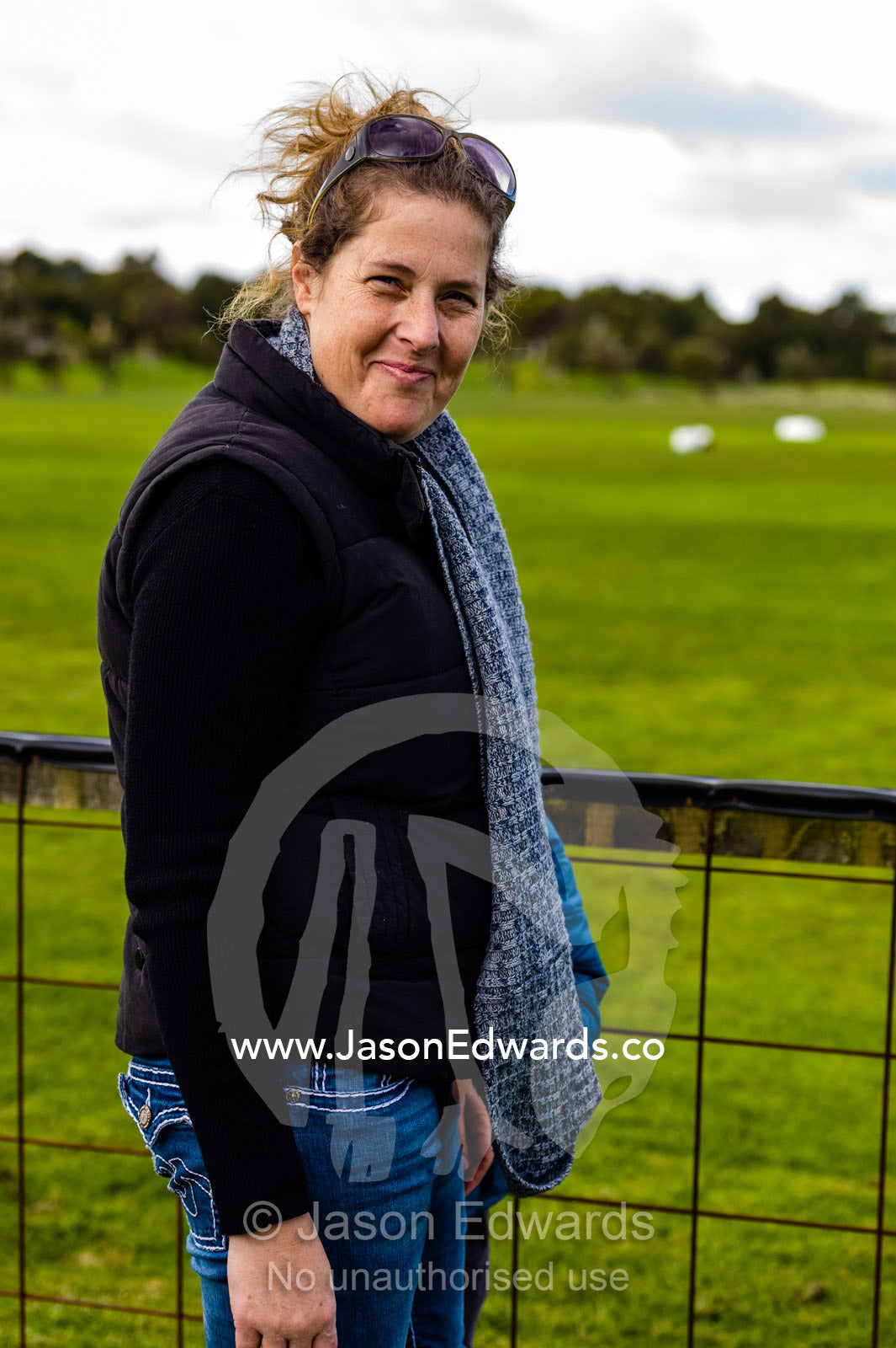 A wife waiting at an airfield for her husband to do his first parachute jump. Torquay, Surf Coast, Victoria, Australia.
