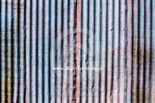 The corrugated tin wall of a sheep shearing shed. Euroa, Strathbogie, Victoria, Australia.
