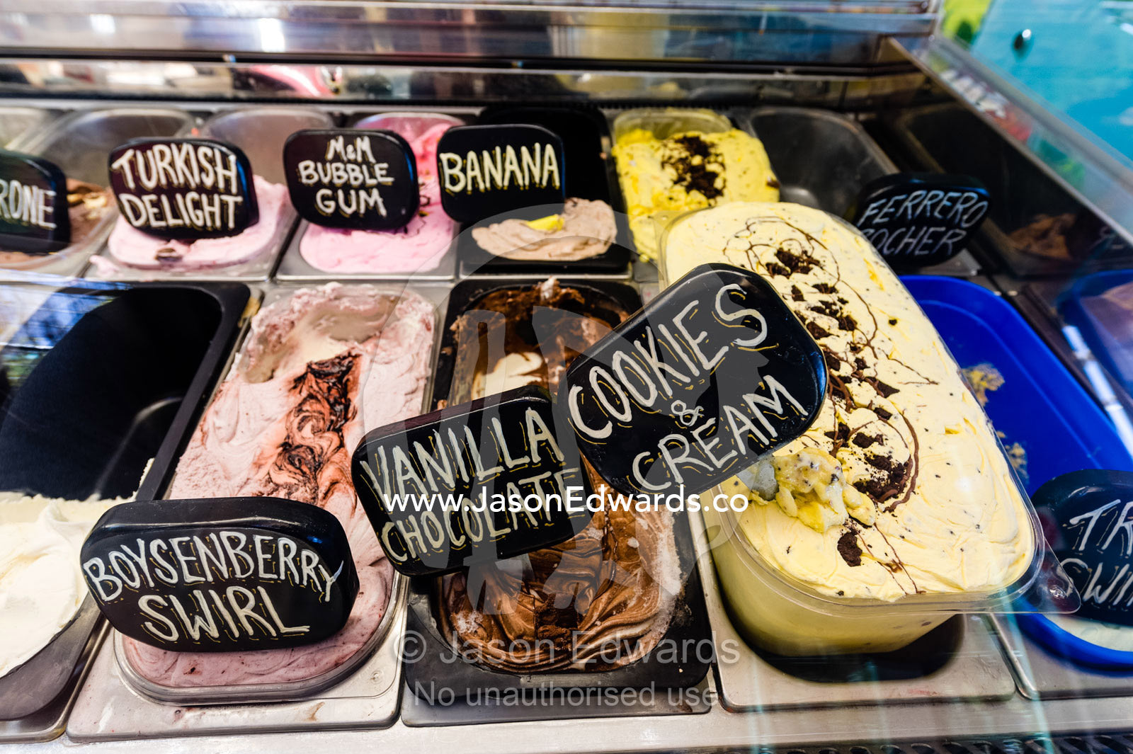 Chocolate, strawberry, vanilla, cookies and cream handmade ice-cream in a display cabinet. Robe, Limestone Coast, South Australia, Australia.