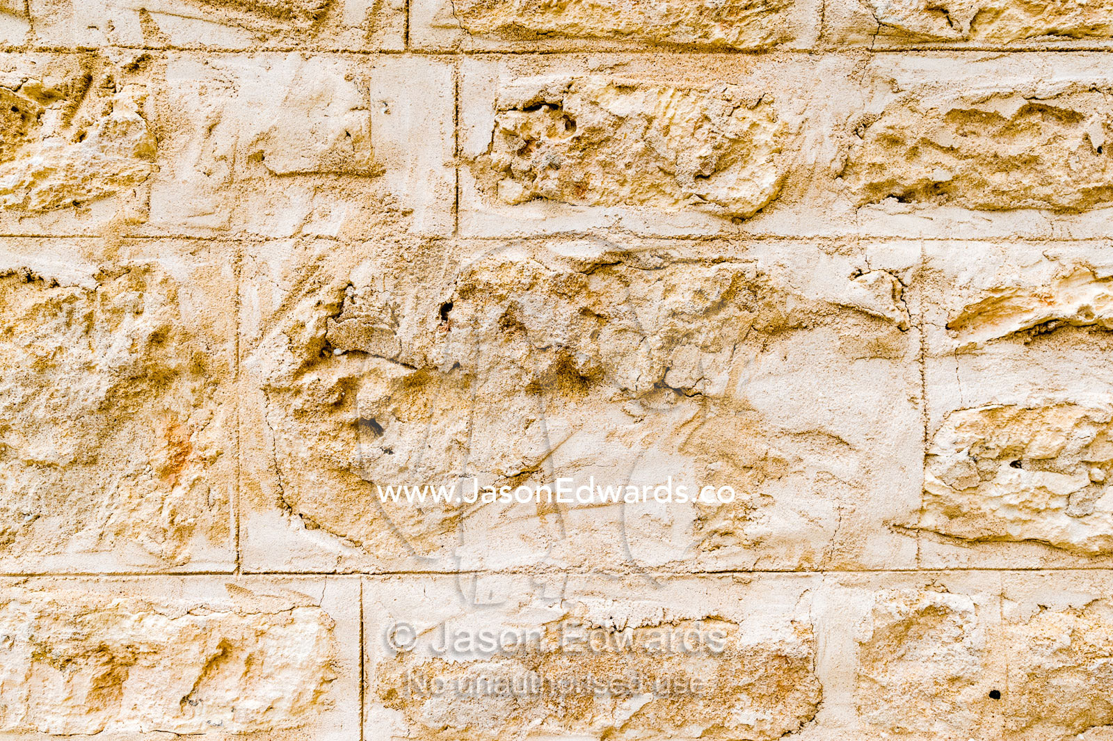 The detail of the bricks in the limestone wall of a church in a rural town. Robe, Limestone Coast, South Australia, Australia.