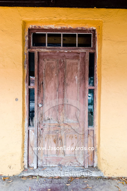 A weathered door in a antique home in a rural town. Robe, Limestone Coast, South Australia, Australia.