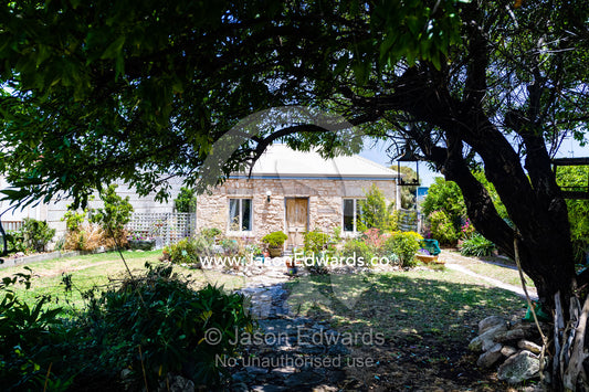 A beautiful limestone cottage and garden in a rural town. Robe, Limestone Coast, South Australia, Australia.