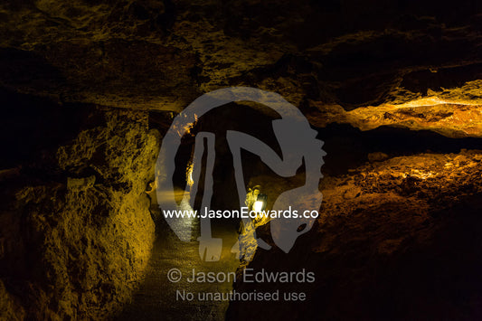A concrete footpath helps protect a fragile cave environment and the stalactites and stalagmites. Naracoorte Caves National Park, South Australia, Australia.
