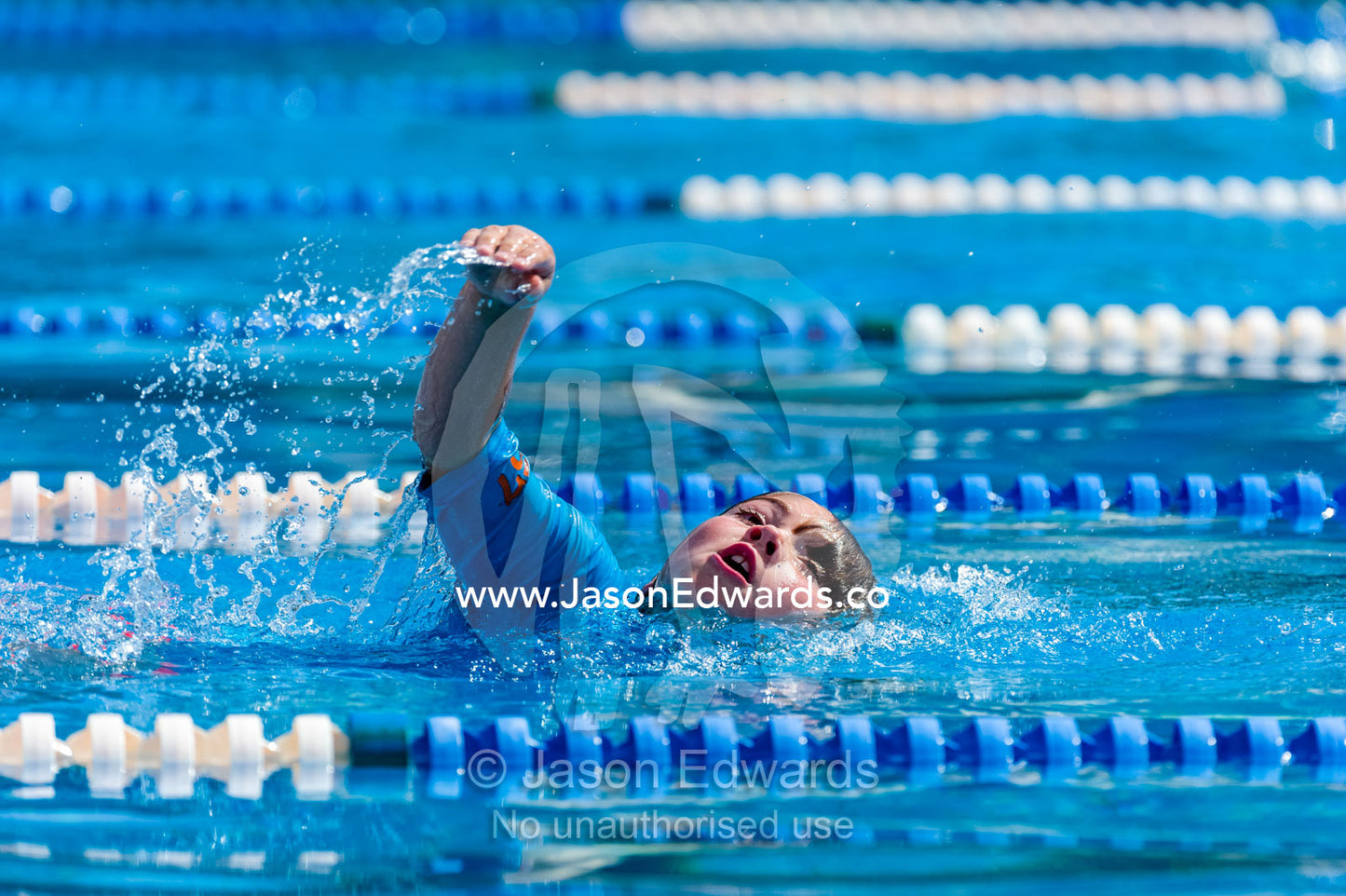 Students competing in races at a school swimming carnival. Fitzroy, Melbourne, Victoria, Australia.