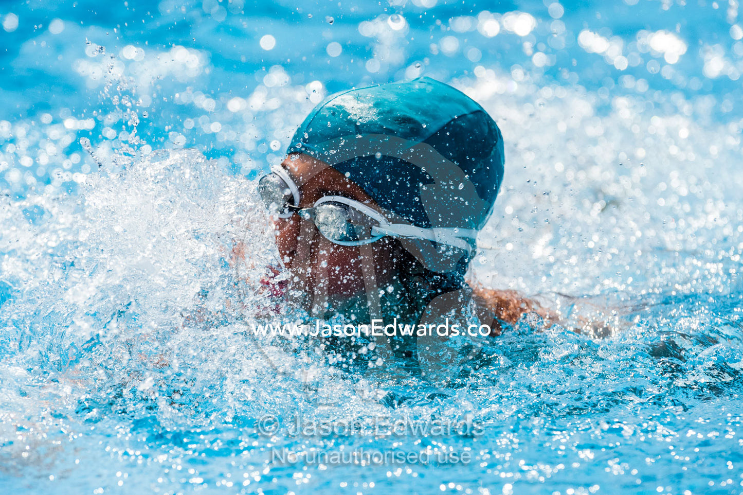 Students competing in races at a school swimming carnival. Fitzroy, Melbourne, Victoria, Australia.