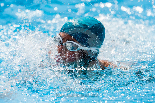 Students competing in races at a school swimming carnival. Fitzroy, Melbourne, Victoria, Australia.